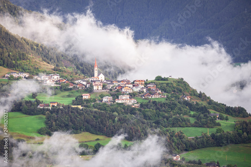 Mountain Village In The Evening Sun With Individual Clouds