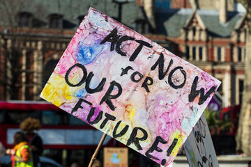 Protestors holding climate change banners at a protest