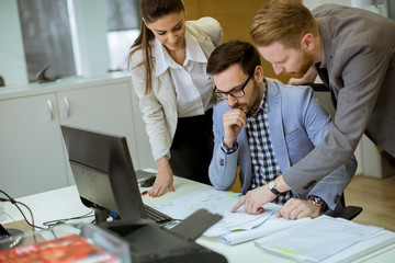 Fototapeta premium Young people working in the office