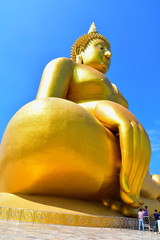 The large buddha statue image has a sky backdrop.