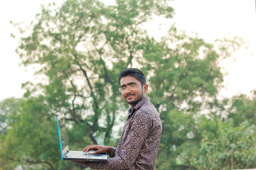  Indian young working on laptop