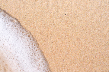 Sand and wave foam in Bali