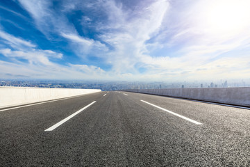 Fototapeta premium Empty asphalt road and modern city skyline with buildings in Shanghai,China