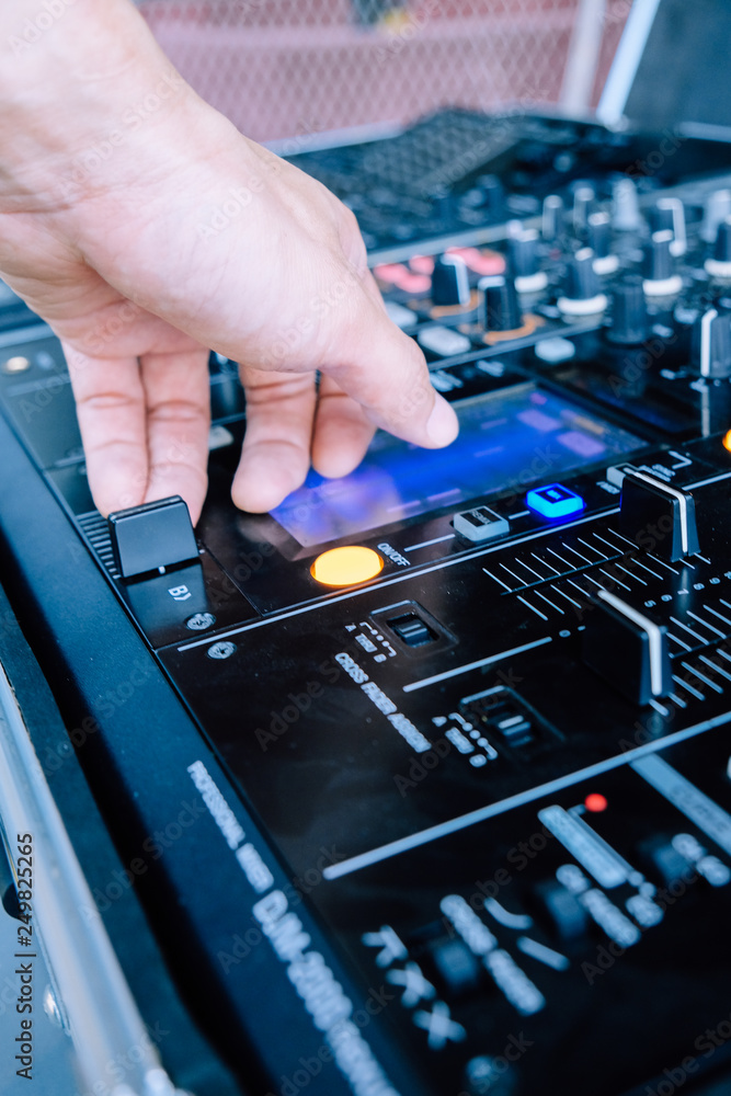 Wall mural Dj playing music at mixer