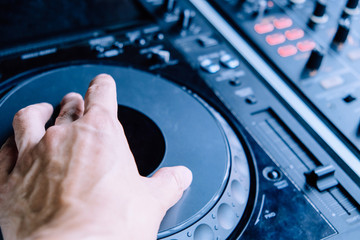 Dj playing music at mixer