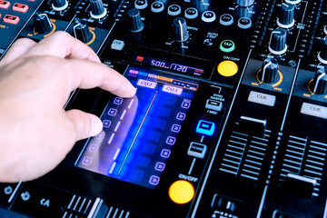 Dj playing music at mixer