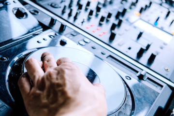 Dj playing music at mixer