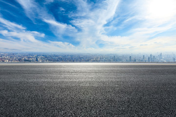 Empty asphalt road and modern city skyline with buildings in Shanghai,China