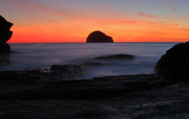 gul rock Trebarwith Strand Cornwall at sunset