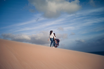 Two pretty women have fun in the dunes of Bologna, Andalucia Spain.