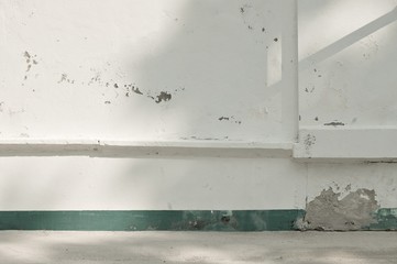 White ruined wall with a green line (Ari Atoll, Maldives)