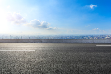 Empty asphalt road and modern city skyline with buildings in Shanghai,China