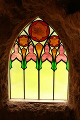 stained glass window from inside cave 