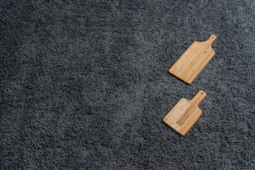 Various kinds of kitchen tools on the grey carpet.