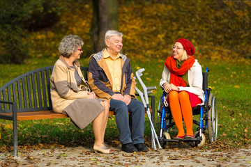 family in the park sitting on a bench