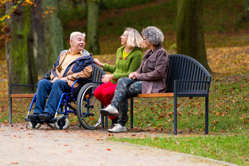 family in the park sitting on a bench