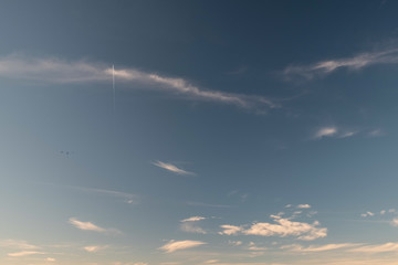 Naklejka na ściany i meble texture background wallpaper blue sky with clouds, an airplane und birds