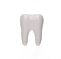Prosthetic one tooth ceramic model on white isolated background
