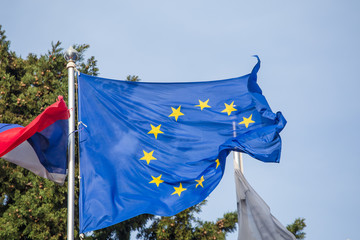 Waving Flag of Europe with emblem of yellow stars on blue, Council of Europe and European Union