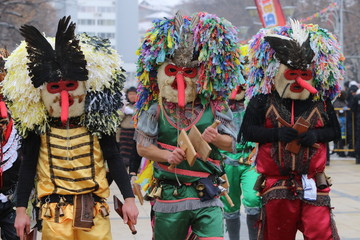 Fototapeta na wymiar Pernik, Bulgaria - January 27, 2019 - Masquerade festival Surva in Pernik, Bulgaria. People with mask called Kukeri dance and perform to scare the evil spirits.