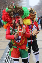 Pernik, Bulgaria - January 27, 2019 - Masquerade festival Surva in Pernik, Bulgaria. People with mask called Kukeri dance and perform to scare the evil spirits.