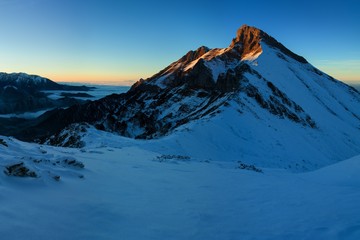 Winter High Tatras mountain range panorama with many peaks and clear sky from Slavkovsky peak....