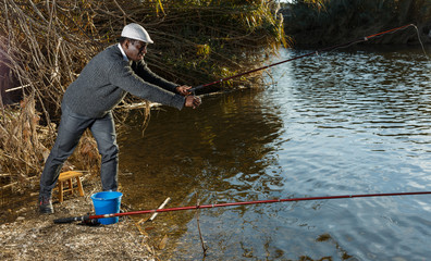 Man fishing with rods