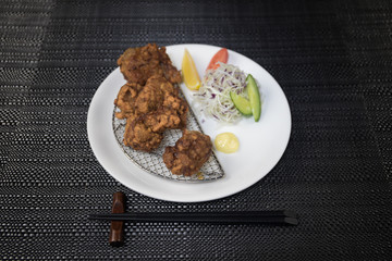Close up view of plate with japanese food inside. Japan traditional food on wooden table.