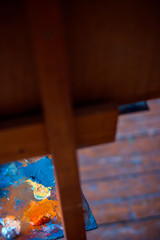 Palette with oil paints in artist studio