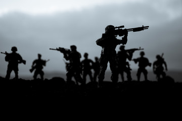 War Concept. Military silhouettes fighting scene on war fog sky background, World War Soldiers...