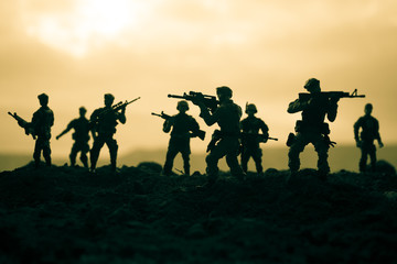 War Concept. Military silhouettes fighting scene on war fog sky background, World War Soldiers...