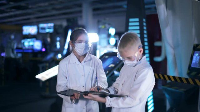 Children scientists in a hi tech laboratory