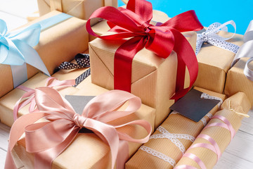 gift boxes with ribbon and bows on a white background, top view