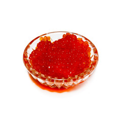 Salmon red caviar is laid out in a glass dish. Isolated on white background.