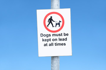Dogs must be kept on a lead or leash sign and icon