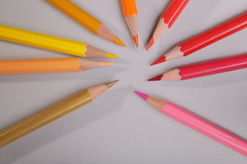 A set of pencils on a gray background.