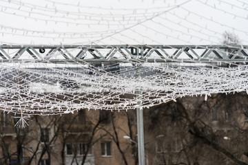 Street garland is turned off in the daytime.