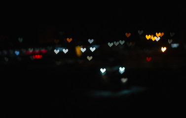  colorful lights of the night city in the form of hearts