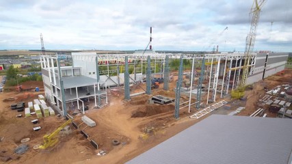 timelapse storage building with cranes from spring to winter