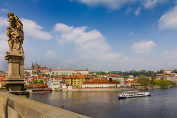 View of historical center of Prague, buildings and landmarks of old town. Boat cruise on Vltava river. Czech Republic. Top tourist attraction in Europe. Concept of travel, sightseeing and tourism. 