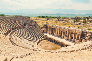 Panorama ancient Greco Roman city. Ruins of ancient city of old amphitheater, Hierapolis in...
