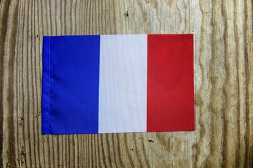 national textile flag on wooden table