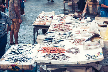 Fresh fish and seafood for sale in the fish market of Catania, Sicily, Italy.