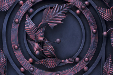 Decoration of metal gates with blacksmith products