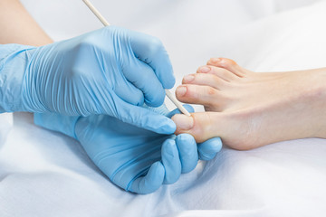 Process of pedicure at beauty salon