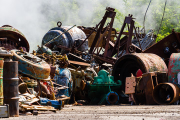 Illegal garbage dump. Large pile of metal waste. The concept of ecology pollution.