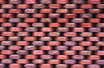 Beautiful decorative wall of colored ragged bricks