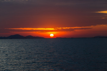Natural background during the sunrise, horizon by the sea, Twilight light wallpaper of bright orange sky. 