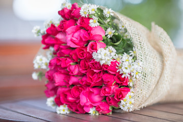 Wallpaper of flowers (roses) that are placed on chairs or wooden tables, to be displayed at festivals or on special occasions (Valentine, wedding, birthday, new year) 