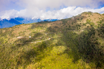 Flying drone towards beautiful amazing famous Mt. Hehuan in Taiwan over above the hilltop, aerial view shot.